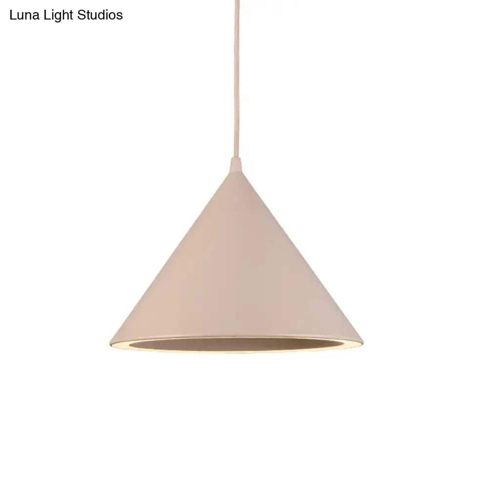 DecorBites nordic stylish beige conical pendant light with matte finish and subtle inner glow hanging lamp over table