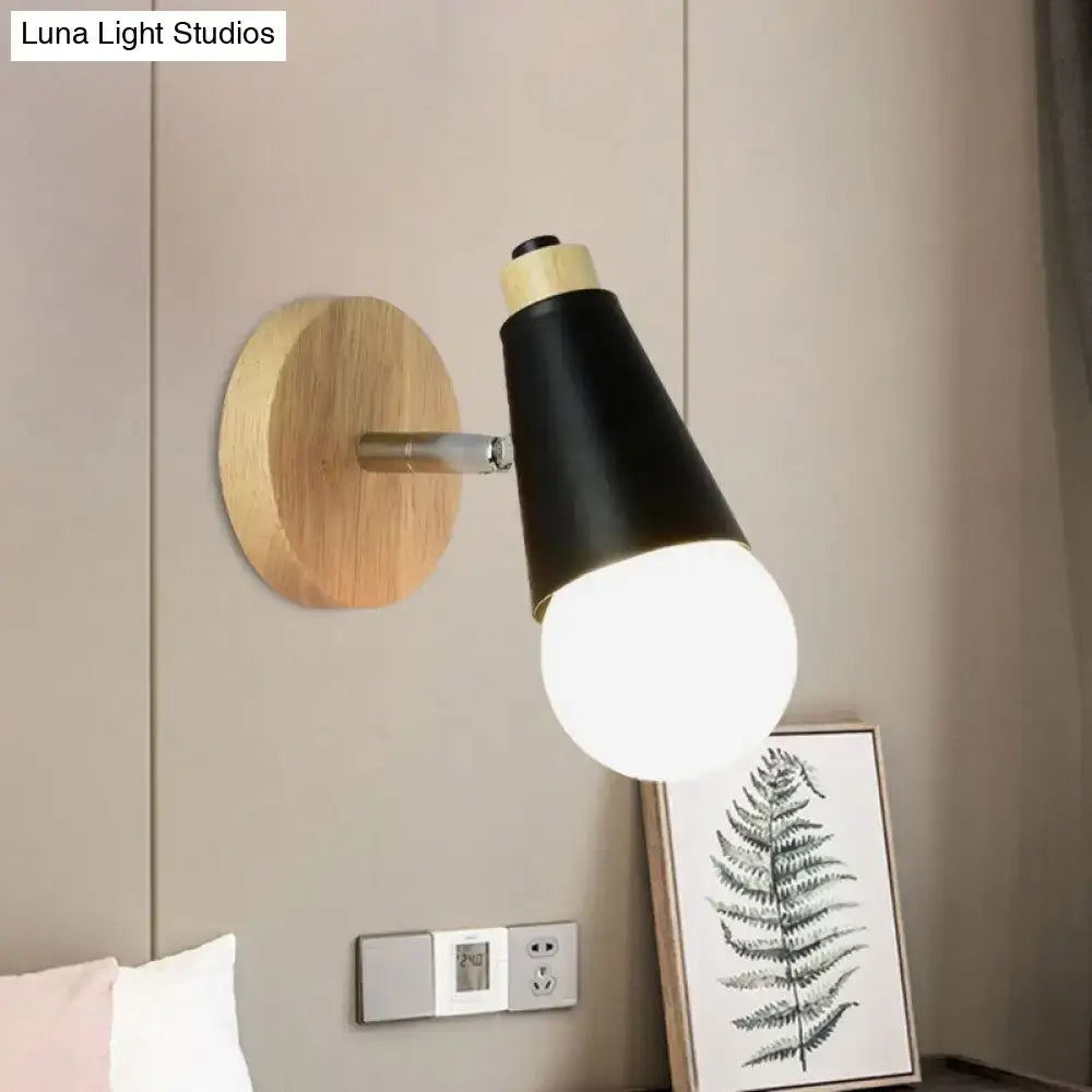 Black nordic sweet cone wall light with exposed bulb brass accents and natural bamboo base for bedroom use