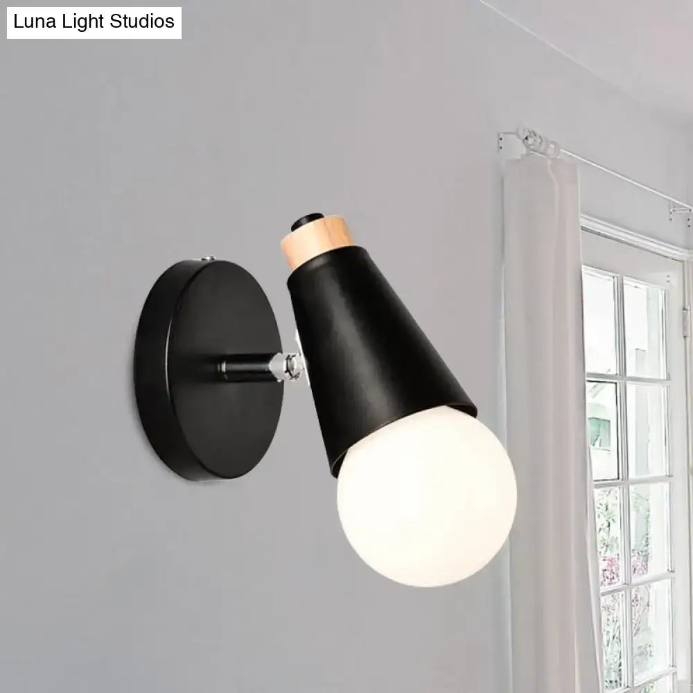 Black nordic sweet cone wall light with matte conical shade, bamboo base, and exposed frosted glass bulb for bedroom use