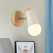 A nordic sweet cone wall light with a circular bamboo base, metallic arm, and frosted white conical shade for bedroom use