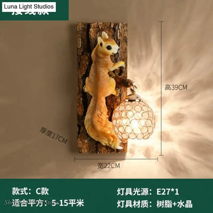 A nordic vintage style wall lamp featuring a beige vintage style resin squirrel holding a crystal globe lamp on wood