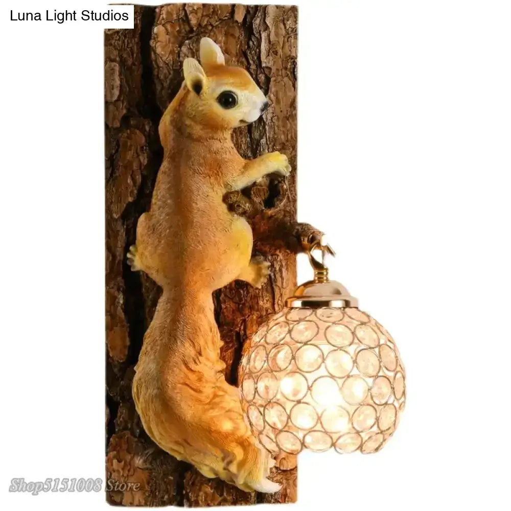 A nordic vintage style resin wall lamp featuring a golden-brown squirrel holding a spherical glass lamp on tree bark