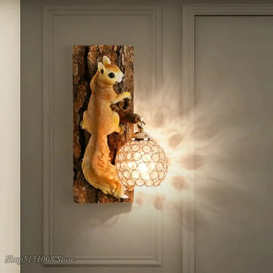 A nordic vintage style resin squirrel wall lamp with a golden-brown figurine mounted on textured wood plank