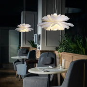 Nordic white acrylic flower pendant chandelier with layered petal-shaped lights offering a soft glow for bedroom decor
