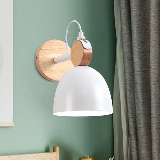 Nordic white and wood wall lamp with angle adjustable domed shade mounted on mint green wall for bedroom use