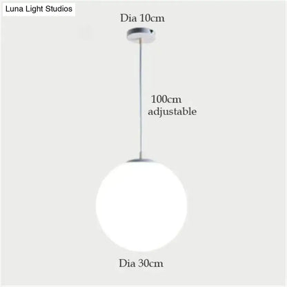Decorbites™ nordic white glass ball pendant lights featuring a sleek frosted glass ball and chrome hardware for modern spaces