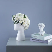 Nordic white human head ceramic vase with white flowers and green leaves decorbites human head living room decor