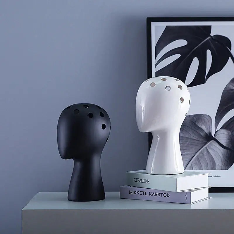 Black and white ceramic human head vases with perforated tops nordic white decorbites ceramic vase for living room decor