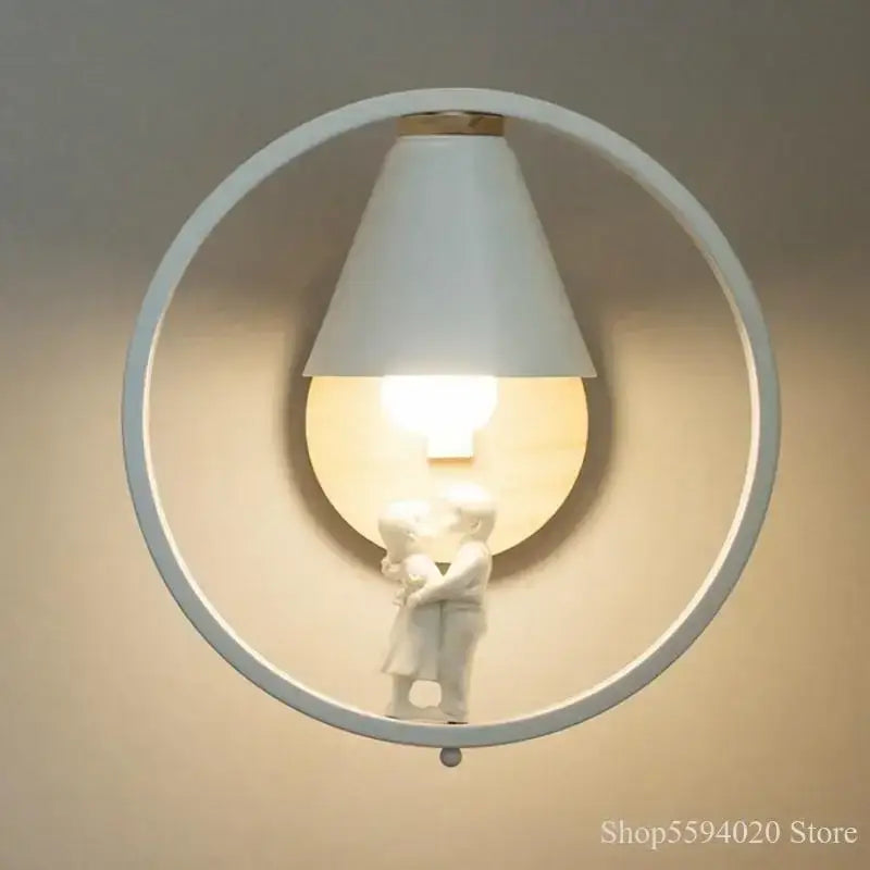 White circular nordic wood and ceramic birdie wall lamp with conical shade and embracing figurine for bedroom light