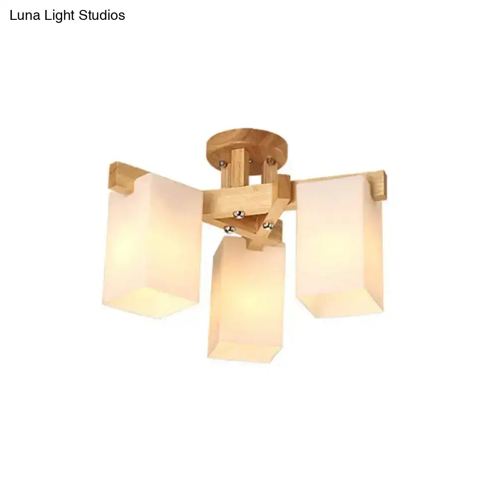 Minimalist wooden ceiling lamp with three frosted cuboid cream glass shades for living room lighting