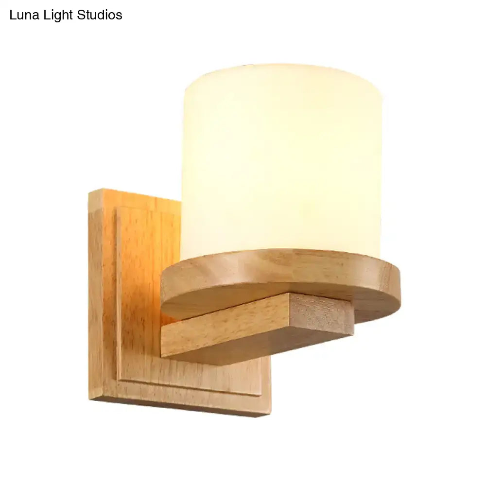 Warm-toned wooden wall lamp with cylindrical opal matte glass shade ideal for bedroom 110v-120v 220v-240v use