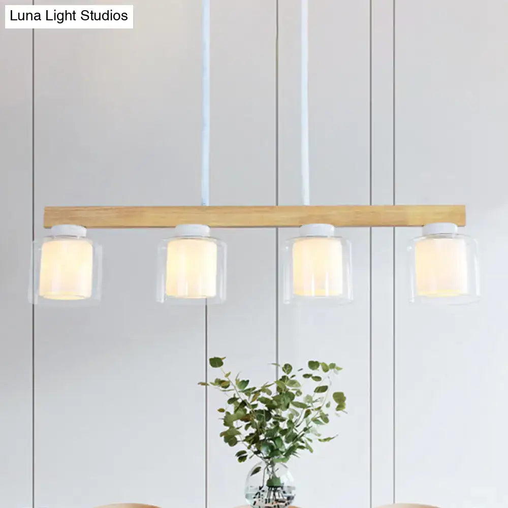 Modern minimalist DecorBites™ Nordic wooden linear pendant light with natural wood bar and four clear glass shades emitting warm illumination