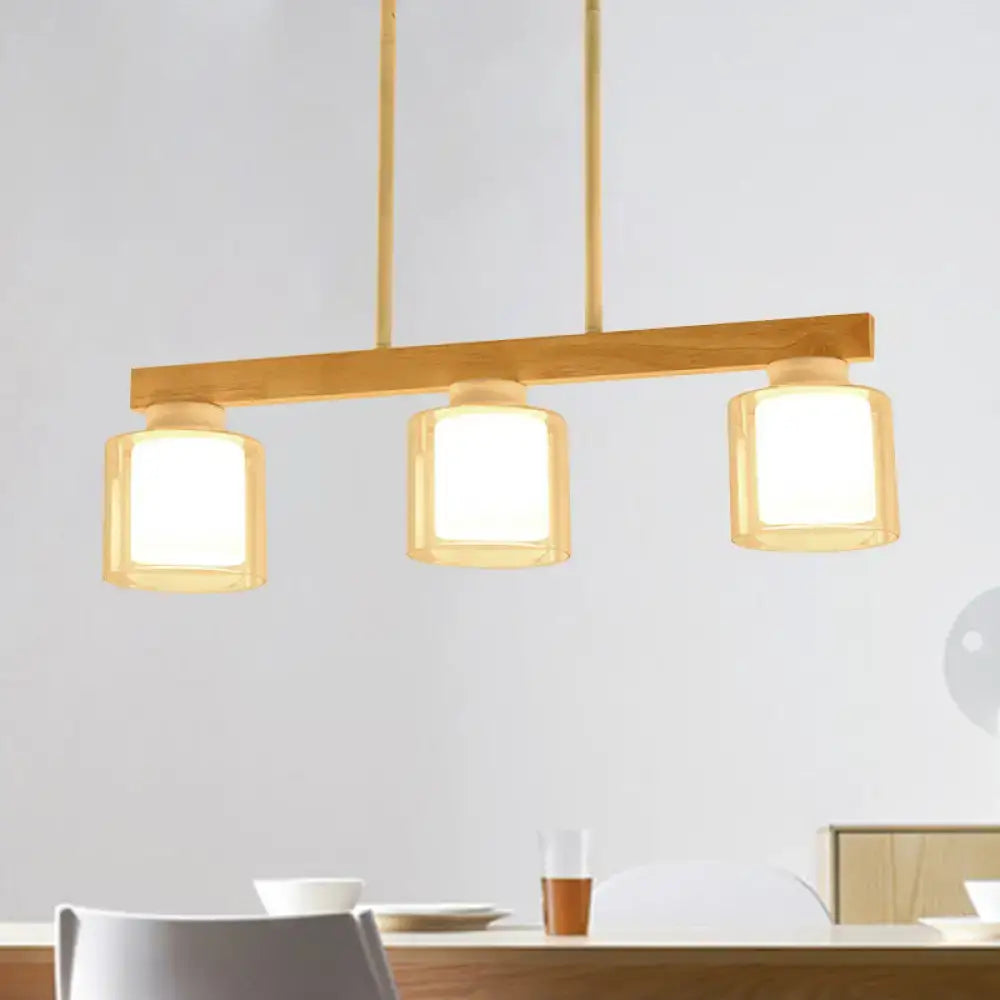 Decorbites nordic wooden linear pendant with warm brass wood bar and three white frosted glass shades for island lighting