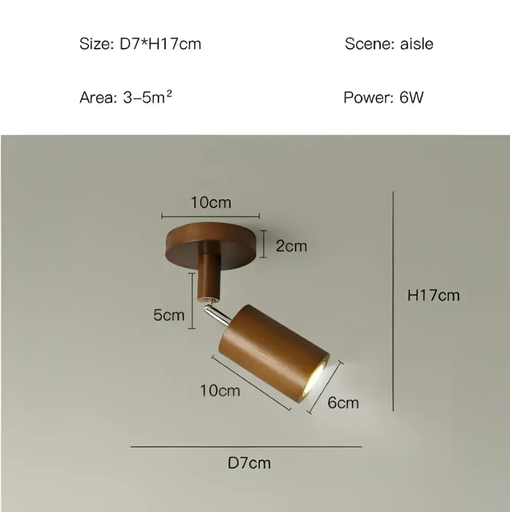 A sleek nordic woodentrack led ceiling spotlight in warm brass with wooden cylindrical adjustable head for living room