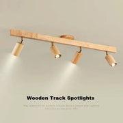 Light beige nordic woodentrack led ceiling spotlight with four cylindrical wooden fixtures for living room use