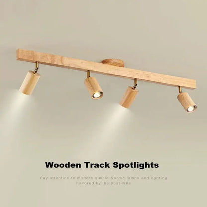 Light beige nordic woodentrack led ceiling spotlight with four cylindrical wooden fixtures for living room use