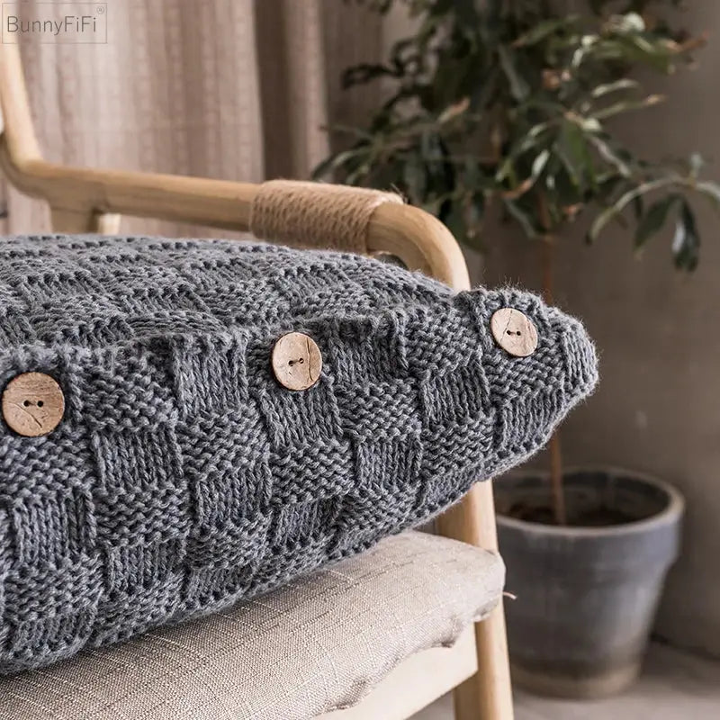 Gray knitted cushion cover with woven texture and three natural wood buttons for nordic decorbites knit pillow
