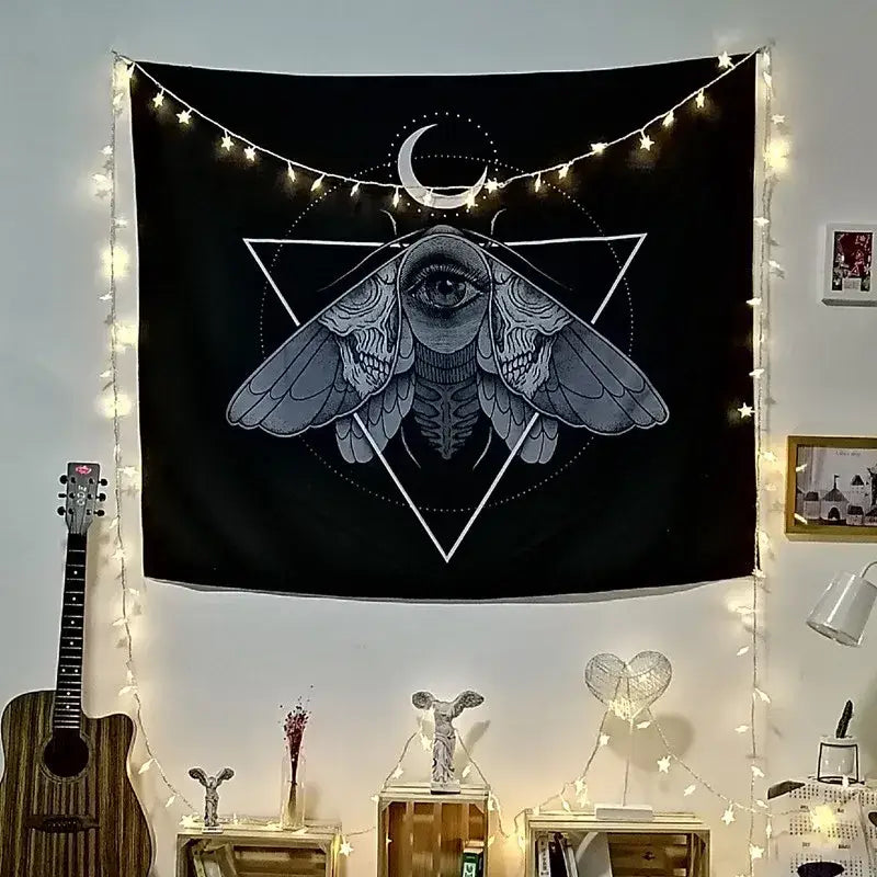 Black tapestry featuring a detailed eye within moth wings and crescent moon for cat coven mysterious wall art