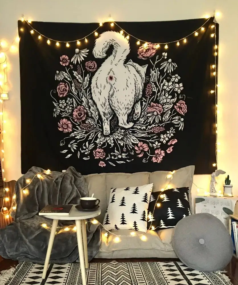 Black tapestry featuring a white illustrated cat with pink flowers for occult cat coven mysterious bedroom wall art