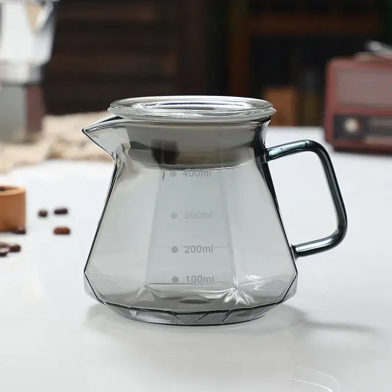 Clear glass coffee kettle octagonal with black metal handle lid and milliliter markings from decorbites glass coffee