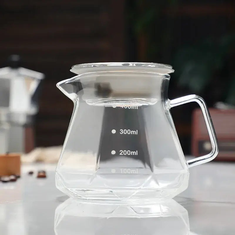 Octagonal clear glass coffee kettle with faceted design and measurement markings for decorbites glass coffee use
