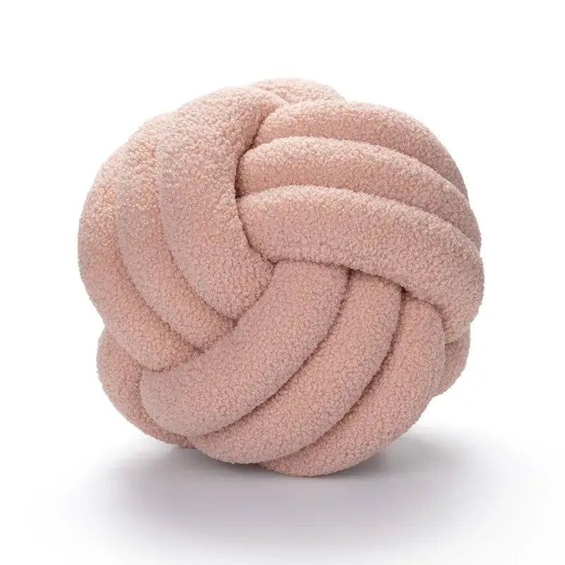 A plush dusty rose boucle knotted circle throw pillow made of soft textured fleece for bedroom decorbites decorbites boucle knotted decor