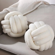 Two off-white decorbites boucle knotted circle throw pillows with plush textured fabric for bedroom decor