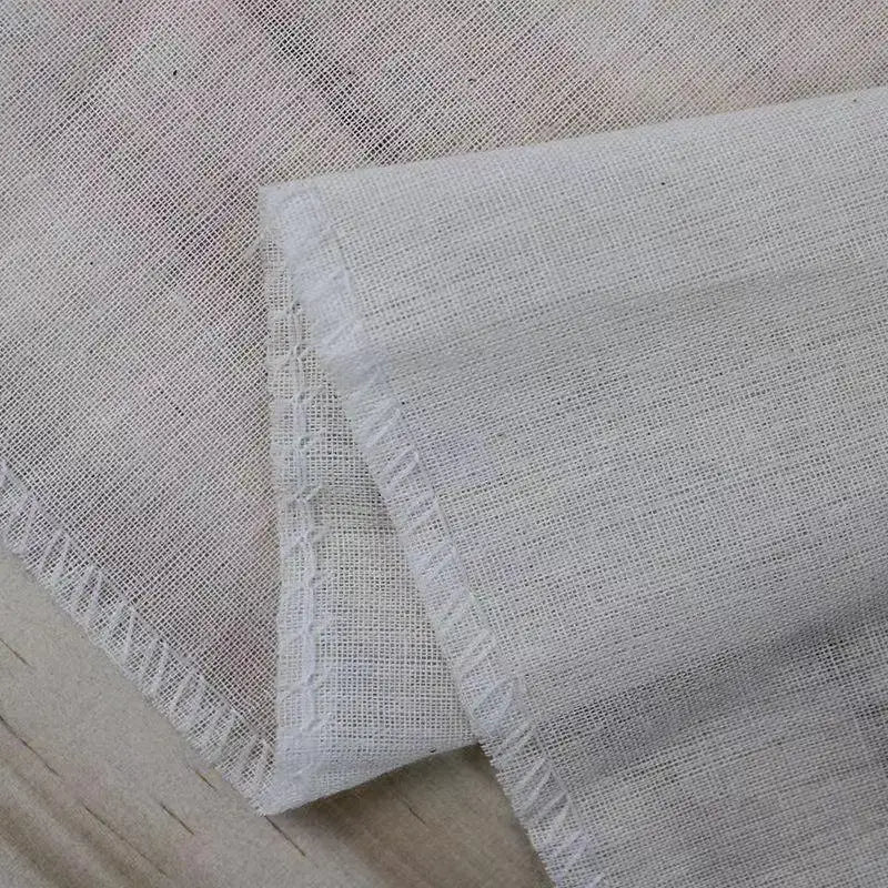 Off-white cotton tofu maker cloth with subtle weave and frayed edges for kitchen homemade cheese decorbites cotton tofu
