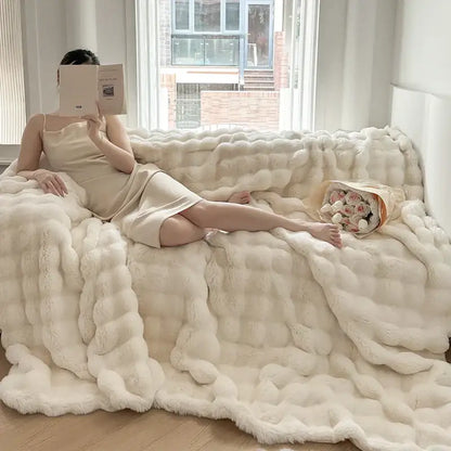 Cream-colored plush chunky knit throw blanket with soft fluffy texture in off-white decorbites deluxe faux rabbit bedding set