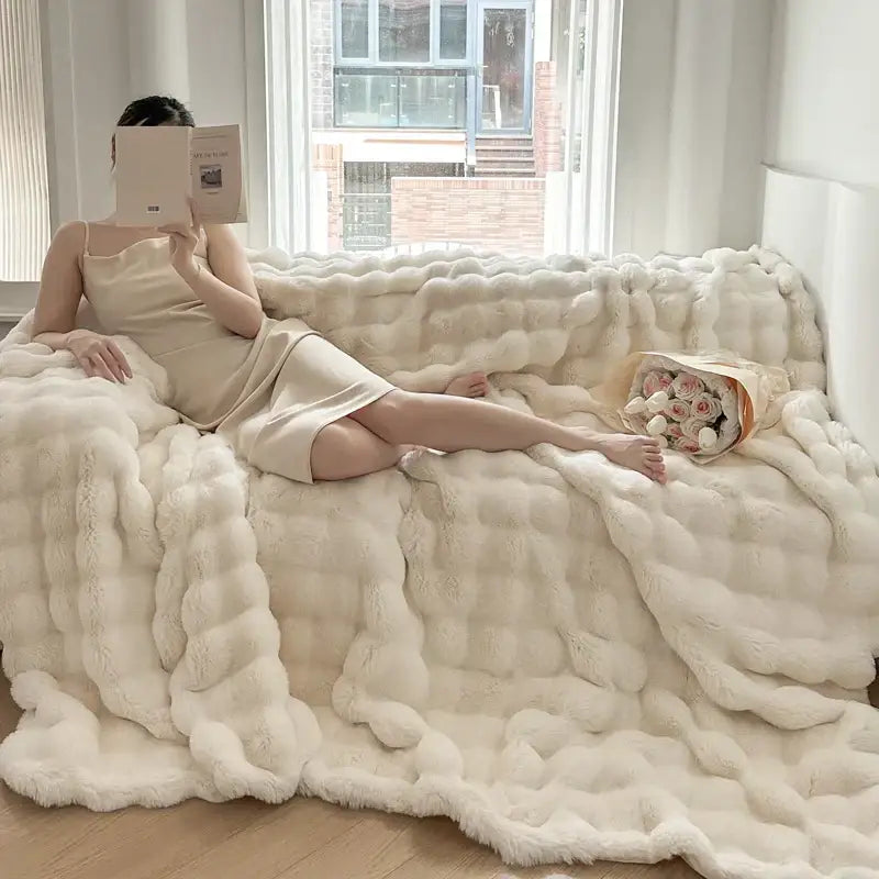 Cream-colored plush chunky knit throw blanket with soft fluffy texture in off-white decorbites deluxe faux rabbit bedding set