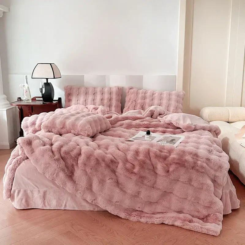 Pink plush faux fur comforter set with textured surface and matching pillows from decorbites deluxe faux rabbit bedding set