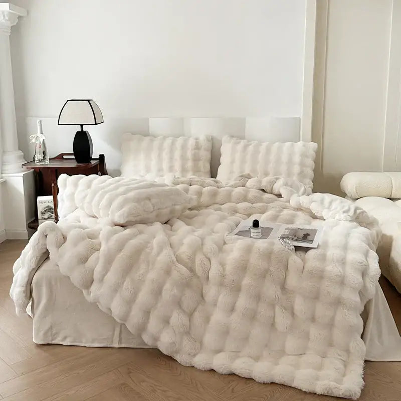 Cream-colored plush deluxe faux rabbit bedding set with textured quilted design and soft fluffy surface from decorbites deluxe faux