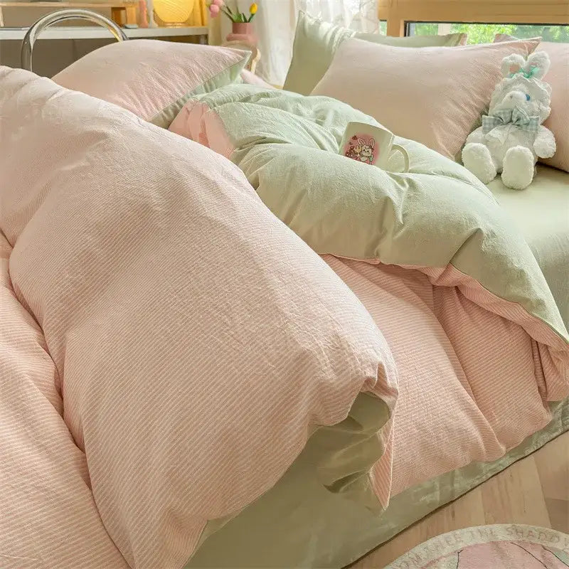 Pastel pink and mint green cotton striped bedding set with subtle ribbed pattern from olive and cream decorbites cotton striped collection