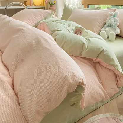 Pastel pink and mint green cotton striped bedding set with subtle ribbed pattern from olive and cream decorbites cotton striped collection