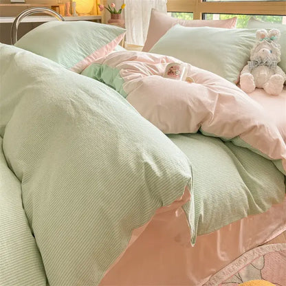 Pastel green and pink striped cotton striped bedding set with soft textured fabric from olive and cream decorbites collection
