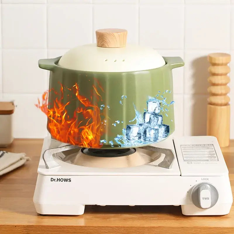Olive green ceramic casserole pot with wooden lid fluted sides and fire ice illustrations for decorbites gas stove rice
