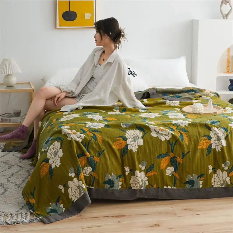 Olive green floral cotton gauze plaid blanket with white and yellow blossoms and dark gray border for decorbites cotton gauze decor