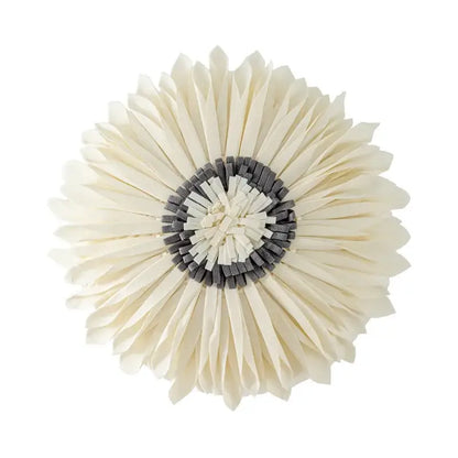Cream-colored layered paper flower with dark gray center on olive green decorbites handmade flower cushion cover