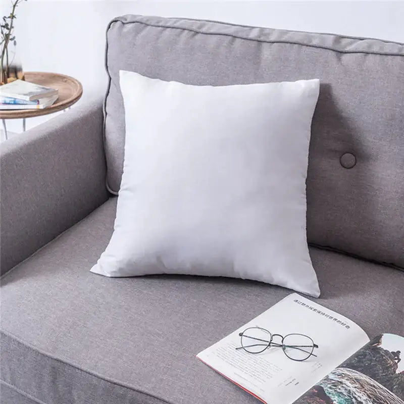 White square cushion with soft fabric texture on gray sofa complementing decorbites handmade flower cushion cover