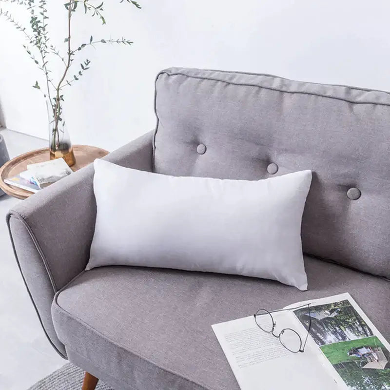 White rectangular cushion on gray sofa featuring olive green decorbites handmade flower cushion cover for living room decor