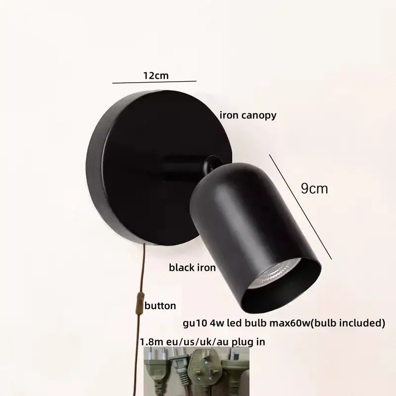 Black iron wall sconce with cylindrical head and circular base for stairwell decorbites led wall sconce lighting