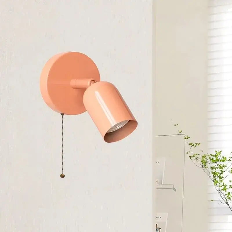 Coral-colored metal led wall sconce with pull chain and cylindrical design for stairwell decorbites led wall lighting