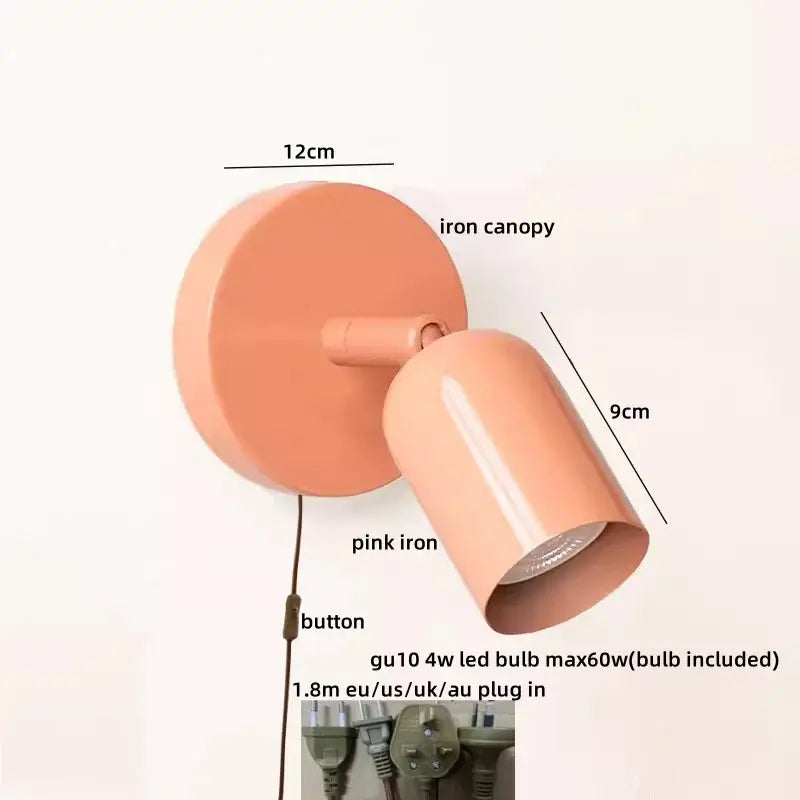 Pink iron wall sconce with cylindrical shade and adjustable head featured as decorbites led wall sconce spotlight