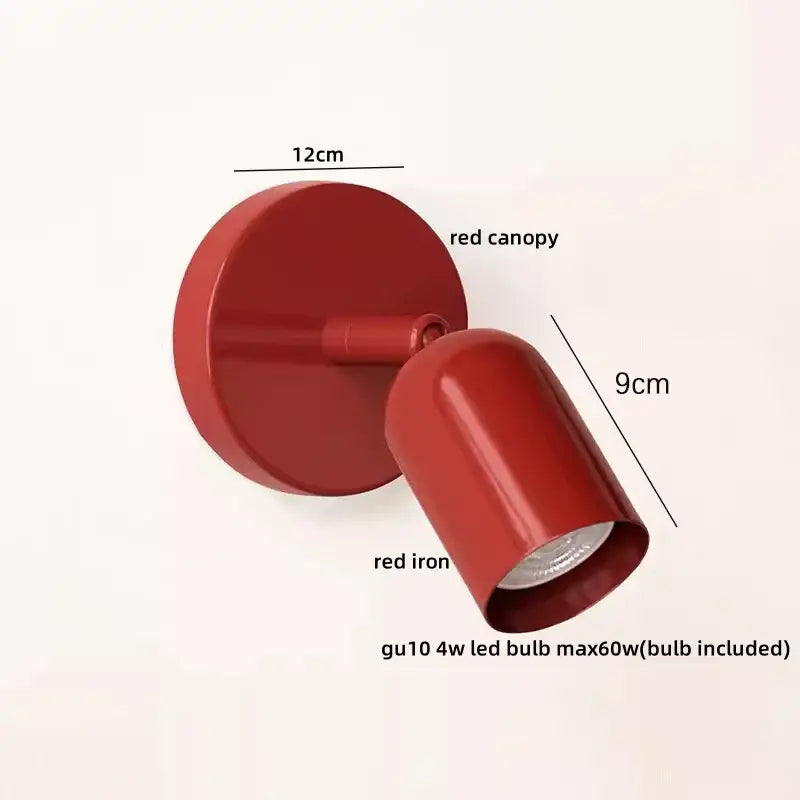 Red iron wall sconce with glossy finish and adjustable head complementing decorbites led wall sconce design