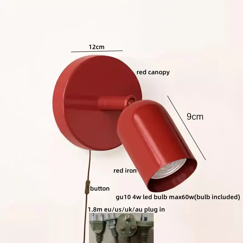 Red iron wall sconce with glossy finish and adjustable head complements decorbites led wall sconce for stairwell lighting