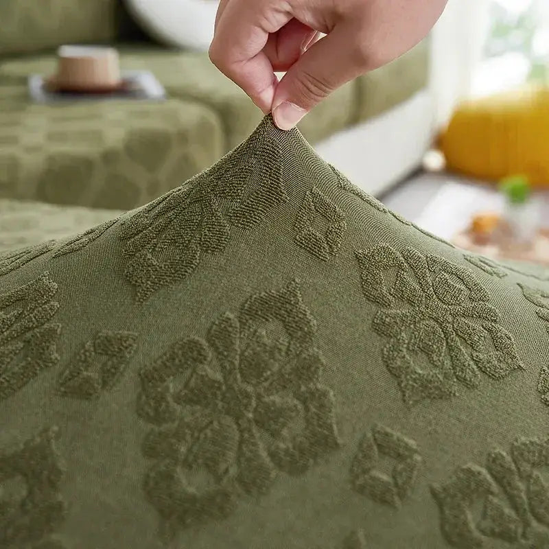 Olive green jacquard sofa seat cover with raised floral and geometric patterns for living room protection