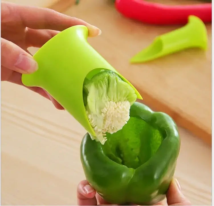 Bright green silicone corer seed remover in use from orange 2pcs vegetable cutter corer kitchen gadget set