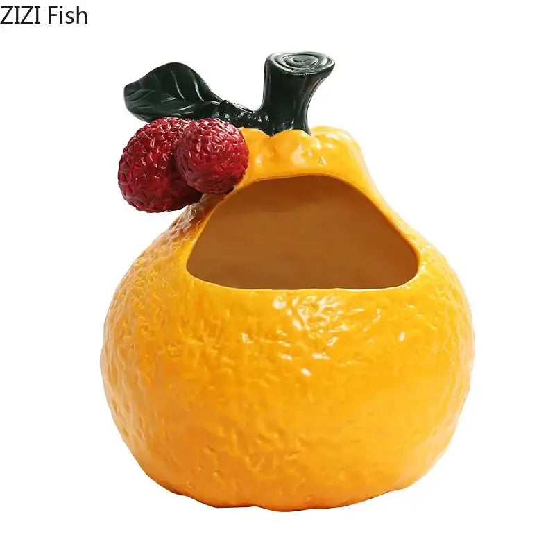 Yellow ceramic fruit-shaped fish tank with red berries and black stem featured in decorbites ceramic ashtray design