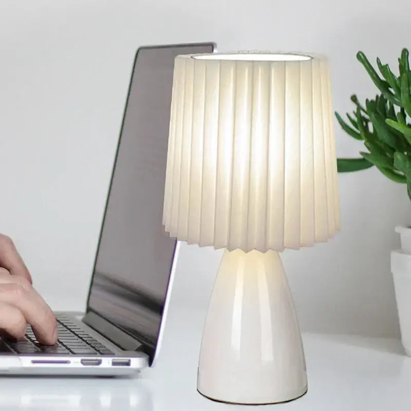 Orange ceramic milkshake bedside lamp with cream pleated lampshade and glossy white ceramic base by decorbites ceramic milkshake