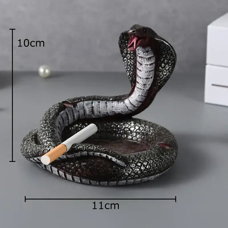 Detailed black and silver decorbites cobra ashtray resin with textured scales and red interior for office decor use